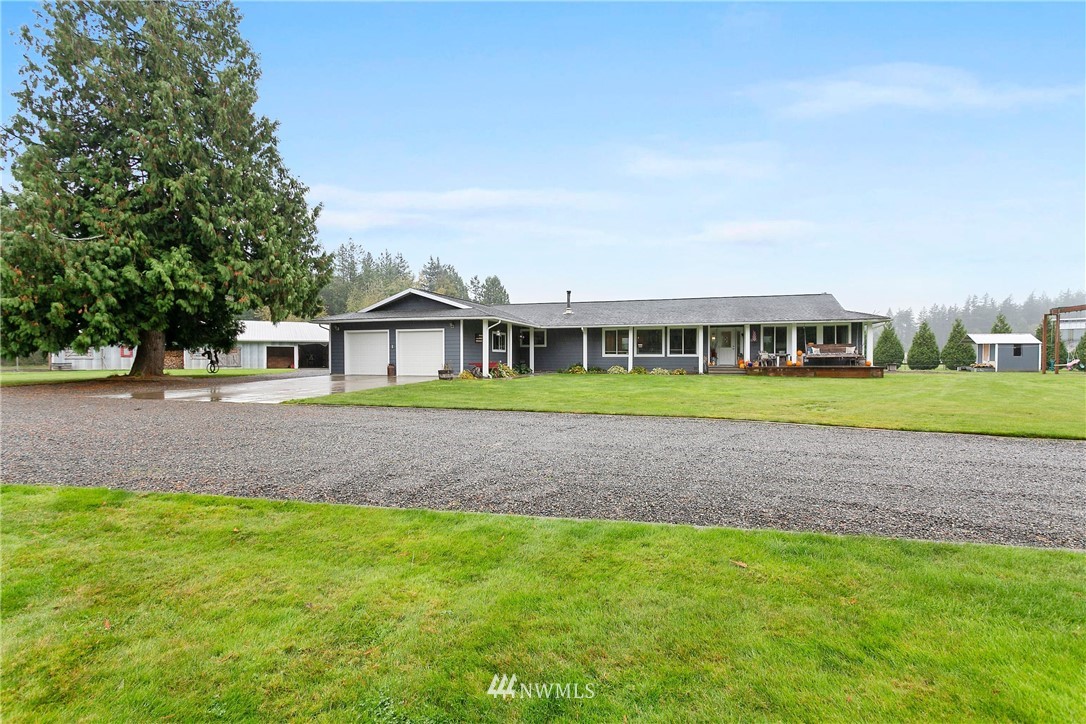 2091 Zell Road Ferndale, WA 98248 - Photo 1 of 25 a view of house with a big yard and large trees