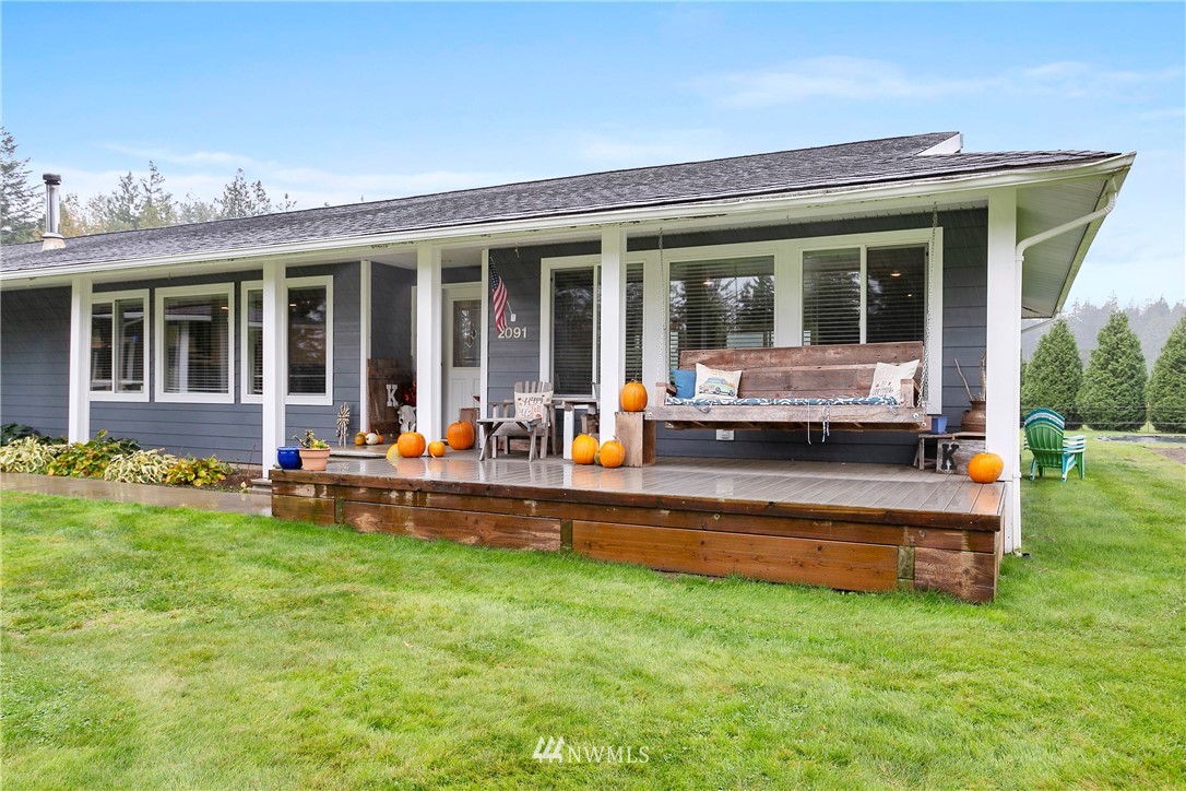 2091 Zell Road Ferndale, WA 98248 - Photo 2 of 25 a view of a house with a backyard and porch