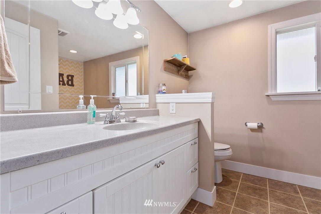 2091 Zell Road Ferndale, WA 98248 - Photo 13 of 25 a bathroom with a sink a toilet and a mirror