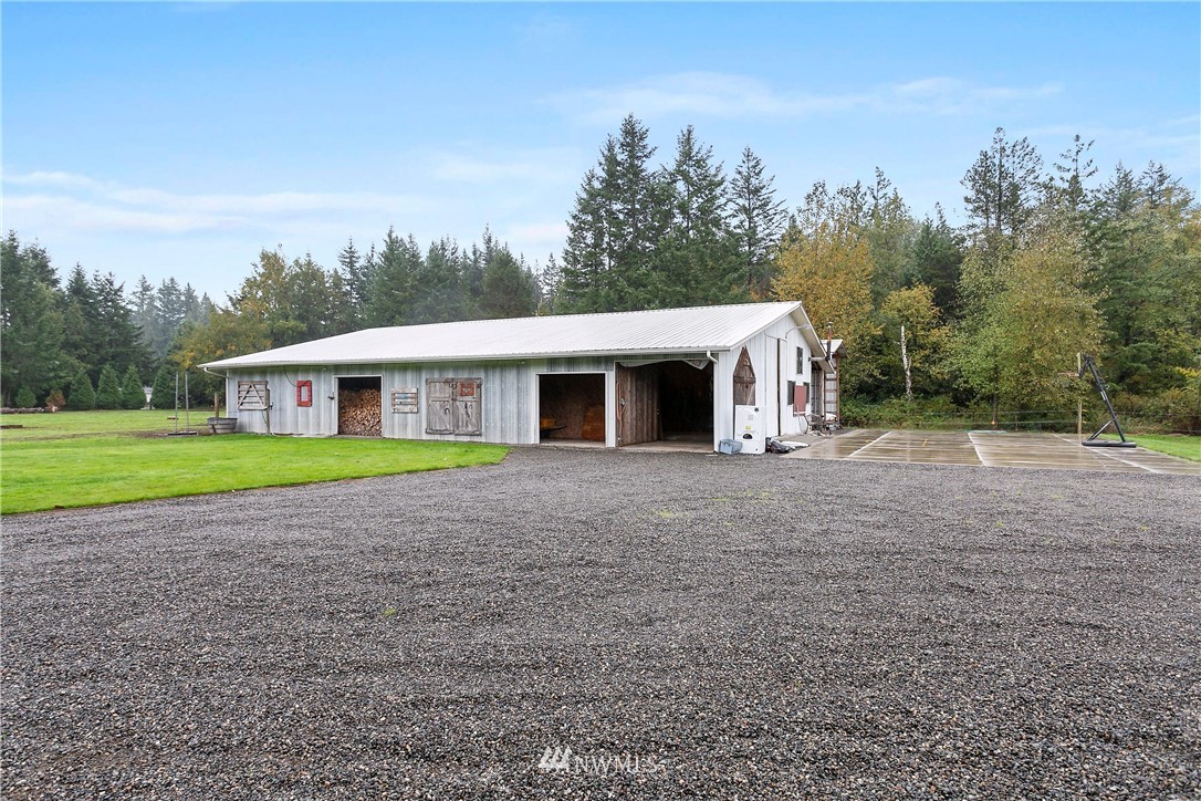 2091 Zell Road Ferndale, WA 98248 - Photo 19 of 25 a house with green field in front of it