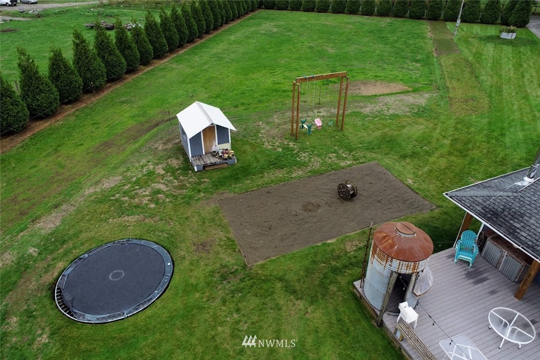 2091 Zell Road Ferndale, WA 98248 - Photo 25 of 25 a backyard of a house with table and chairs