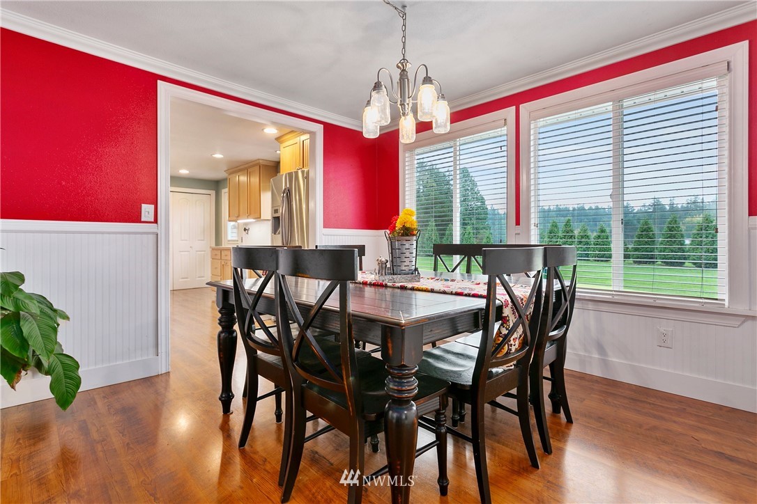 2091 Zell Road Ferndale, WA 98248 - Photo 7 of 25 a view of a dining room with furniture window and wooden floor