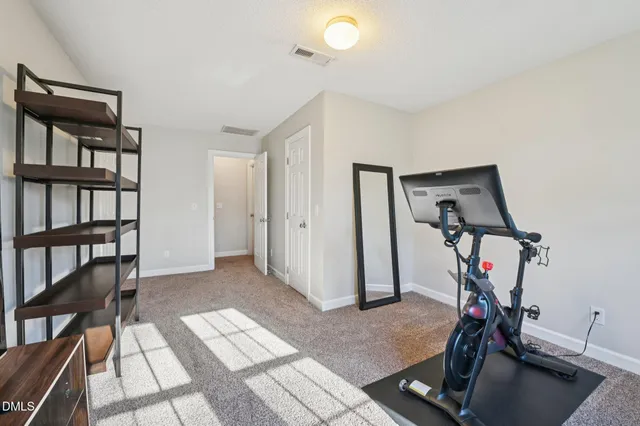 a bathroom with a sink toilet and mirror