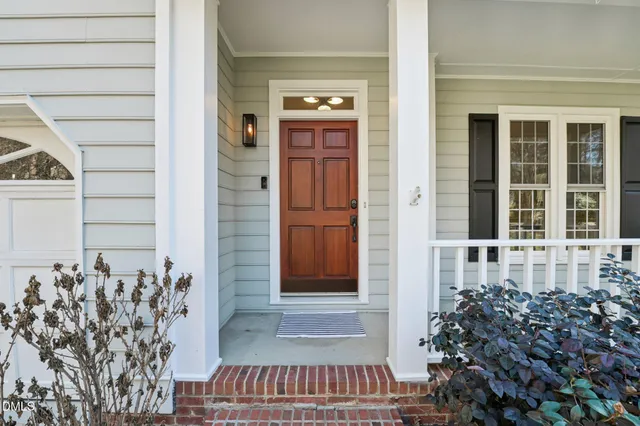 a living room with furniture fireplace and flat screen tv