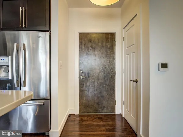 a view of front door with wooden floor