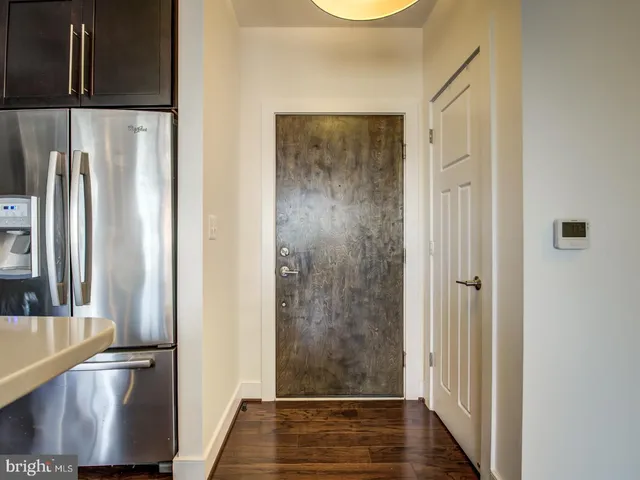 a view of front door with wooden floor