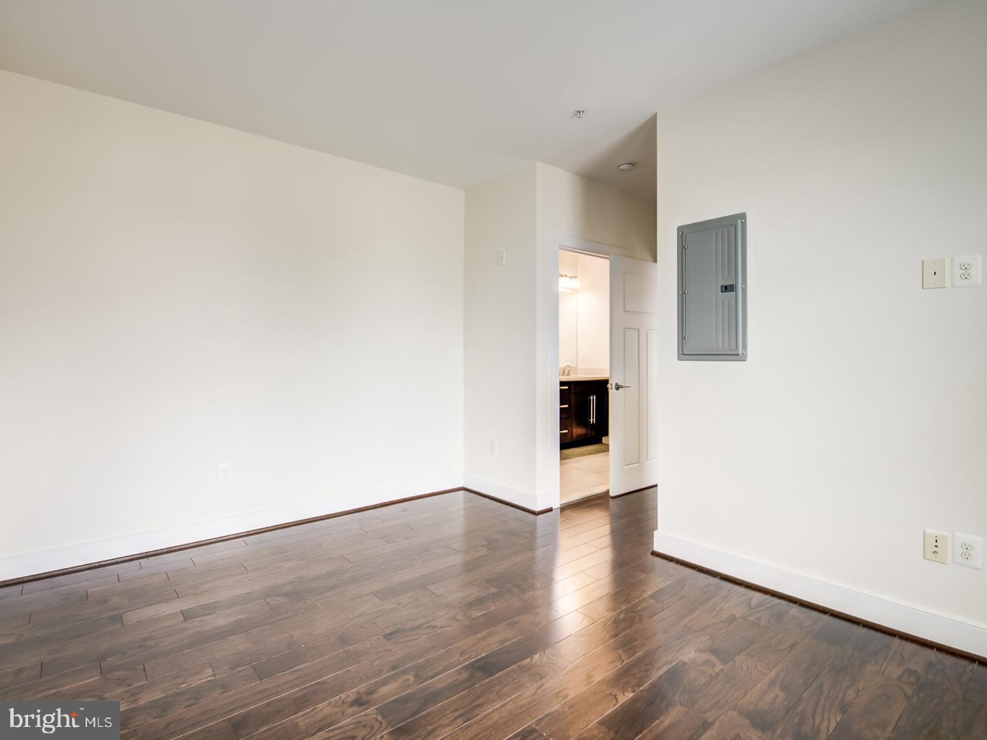 1107 South Walter Reed Drive, Unit 302 Arlington, VA 22204 - Photo 32 of 50 a view of an empty room with wooden floor
