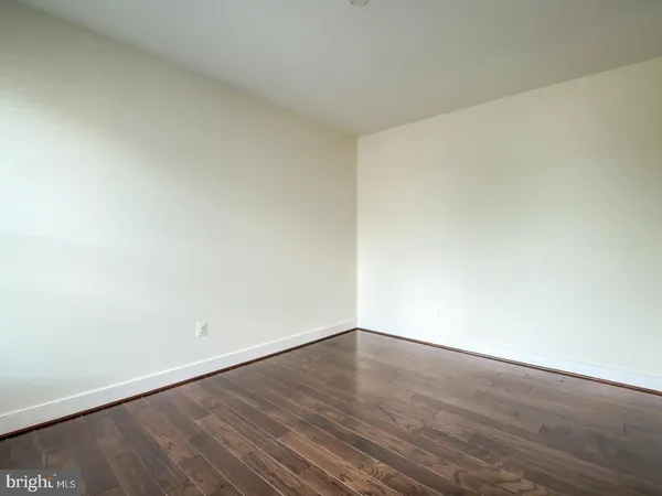 an empty room with wooden floor