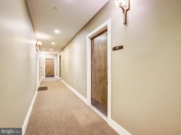 a view of hallway with a hallway and wooden floor