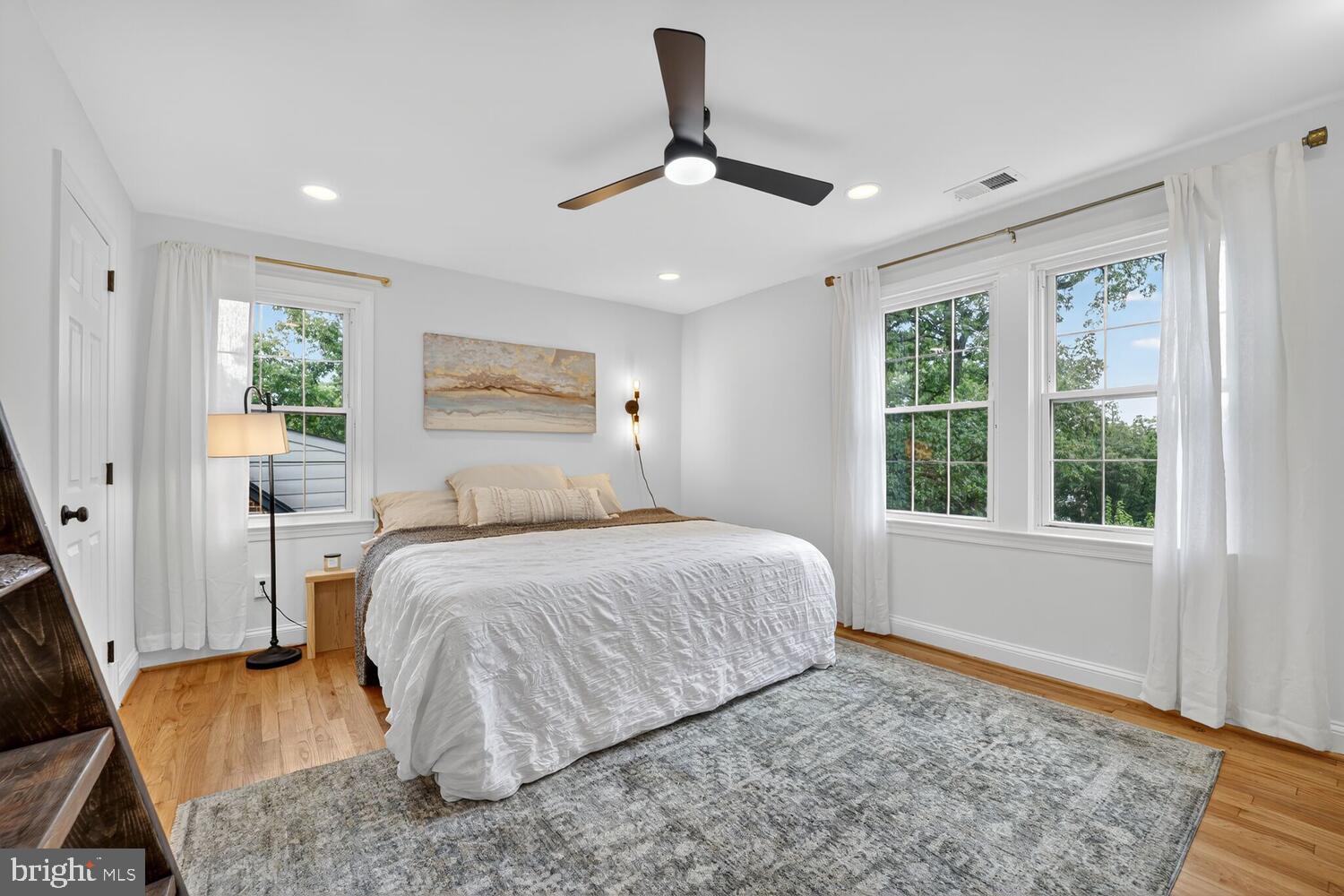 6017 Inwood Street Landover, MD 20785 - Photo 18 of 33 a bedroom with a bed chandelier and window