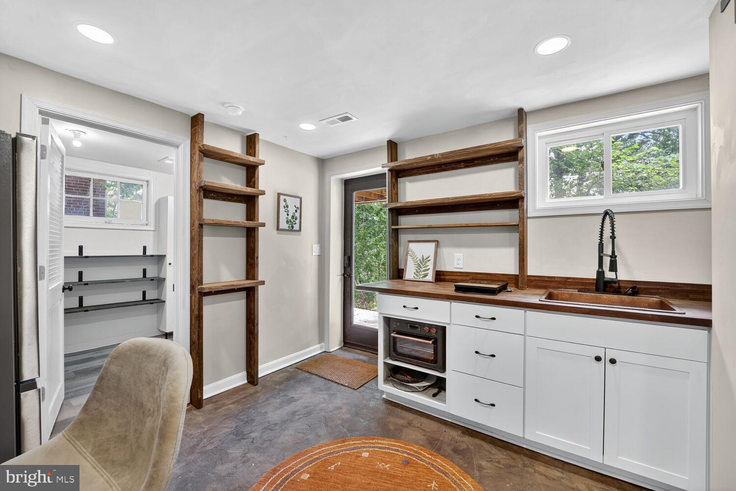 6017 Inwood Street Landover, MD 20785 - Photo 23 of 33 a kitchen with stainless steel appliances a stove sink and refrigerator