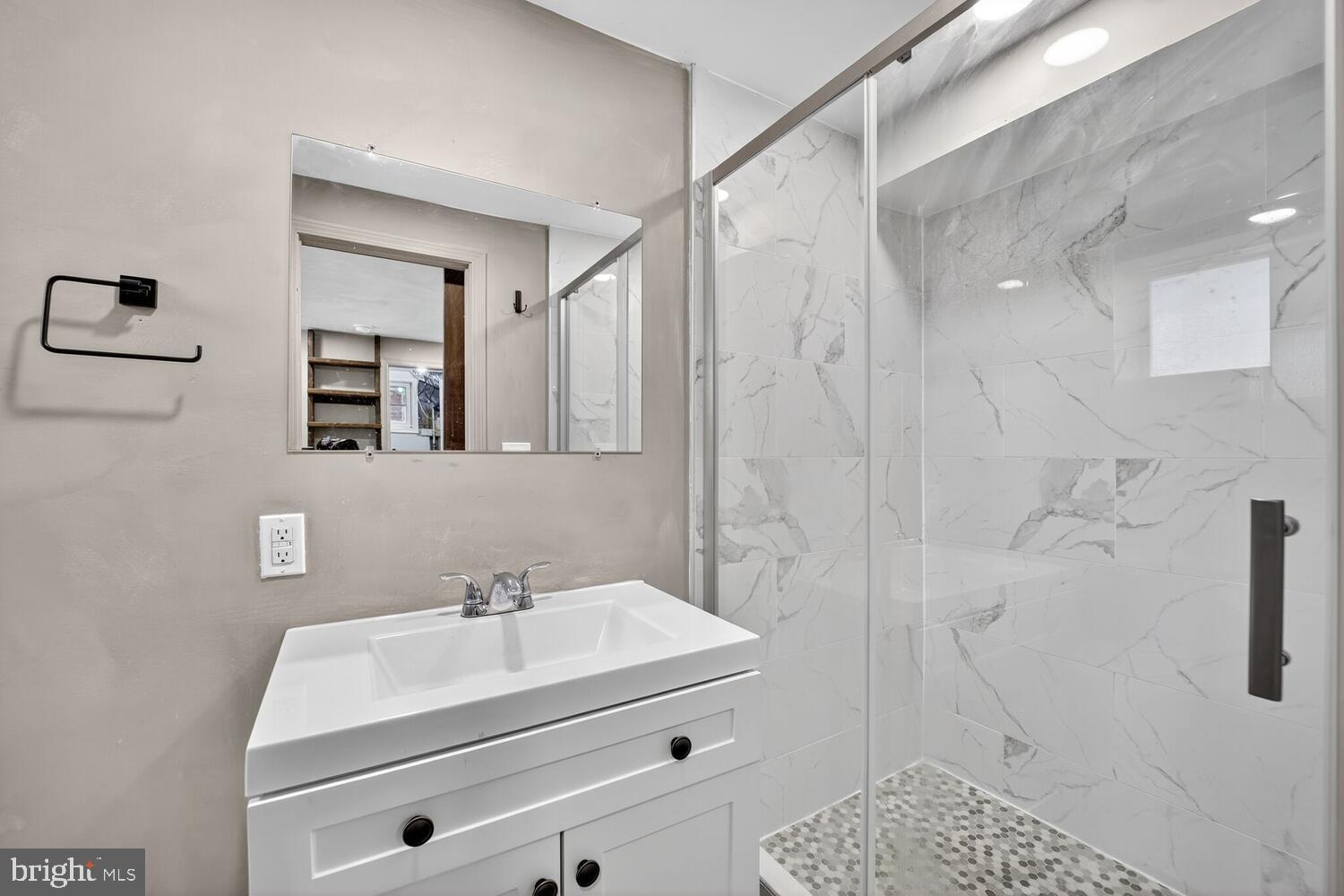 6017 Inwood Street Landover, MD 20785 - Photo 25 of 33 a bathroom with a sink a toilet and shower