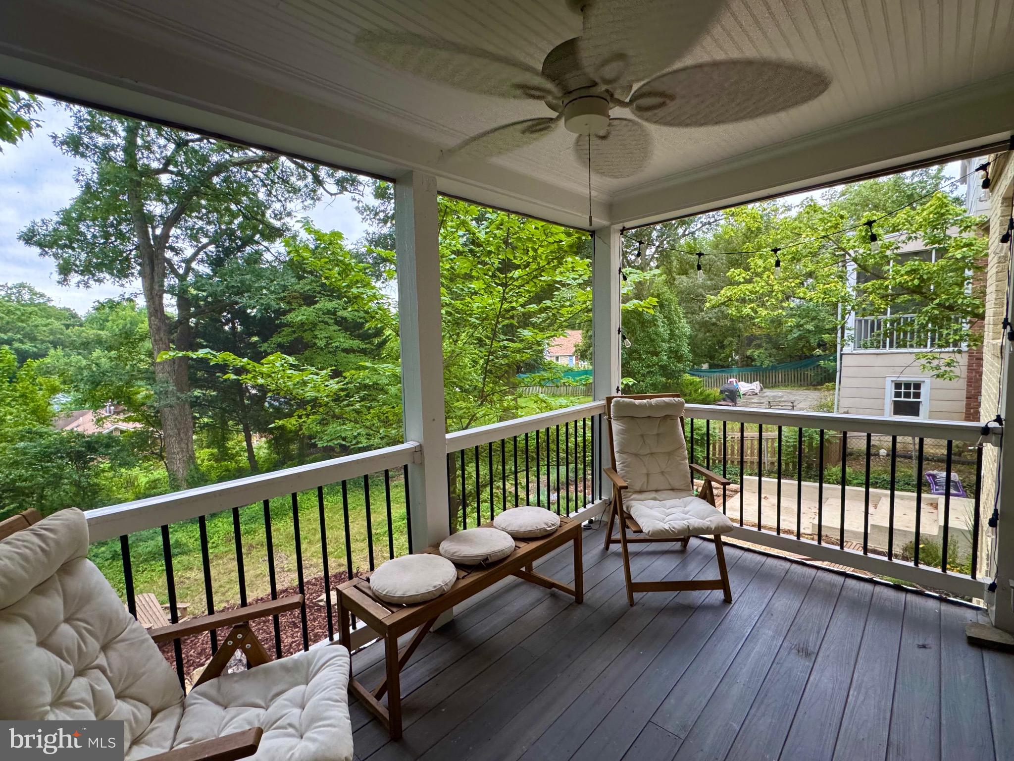 6017 Inwood Street Landover, MD 20785 - Photo 29 of 33 a view of a chairs and table in patio with wooden floor
