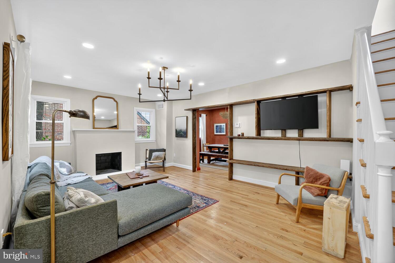 6017 Inwood Street Landover, MD 20785 - Photo 5 of 33 a living room with furniture a fireplace and a flat screen tv
