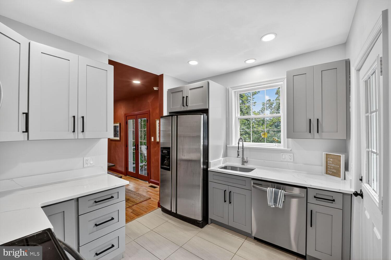 6017 Inwood Street Landover, MD 20785 - Photo 9 of 33 a kitchen with a refrigerator sink and cabinets
