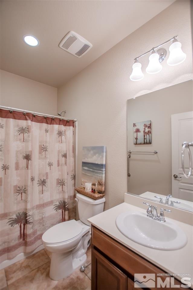 1137 Callaway Trail Reno, NV 89523 - Photo 13 of 22 a bathroom with a sink toilet and a mirror