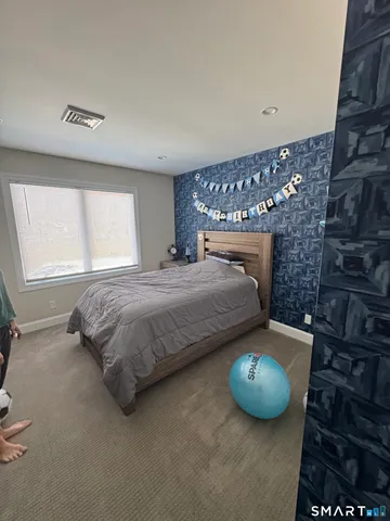 a bedroom with bunk beds and a window