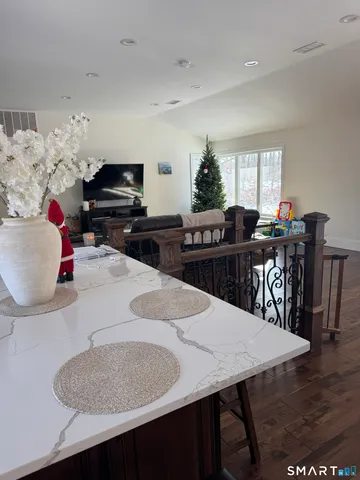 a bathroom with a sink a toilet a mirror and shower