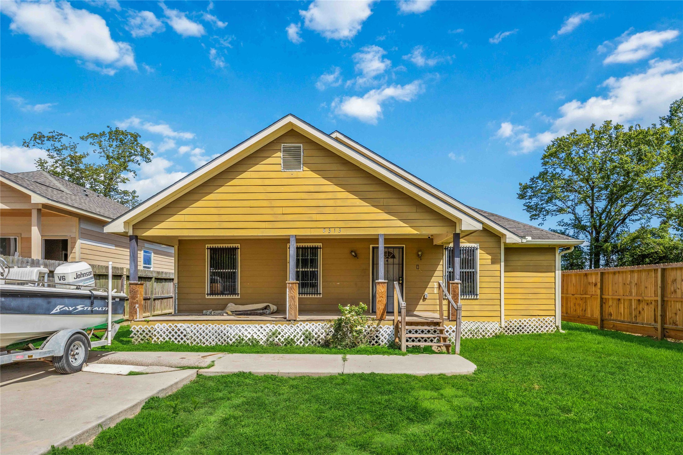 a view of a house with a yard