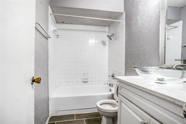 a bathroom with a sink a toilet and a bathtub