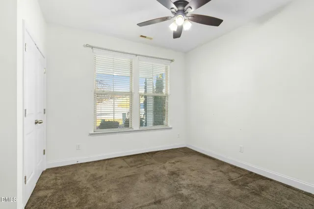 a bathroom with a shower sink and vanity