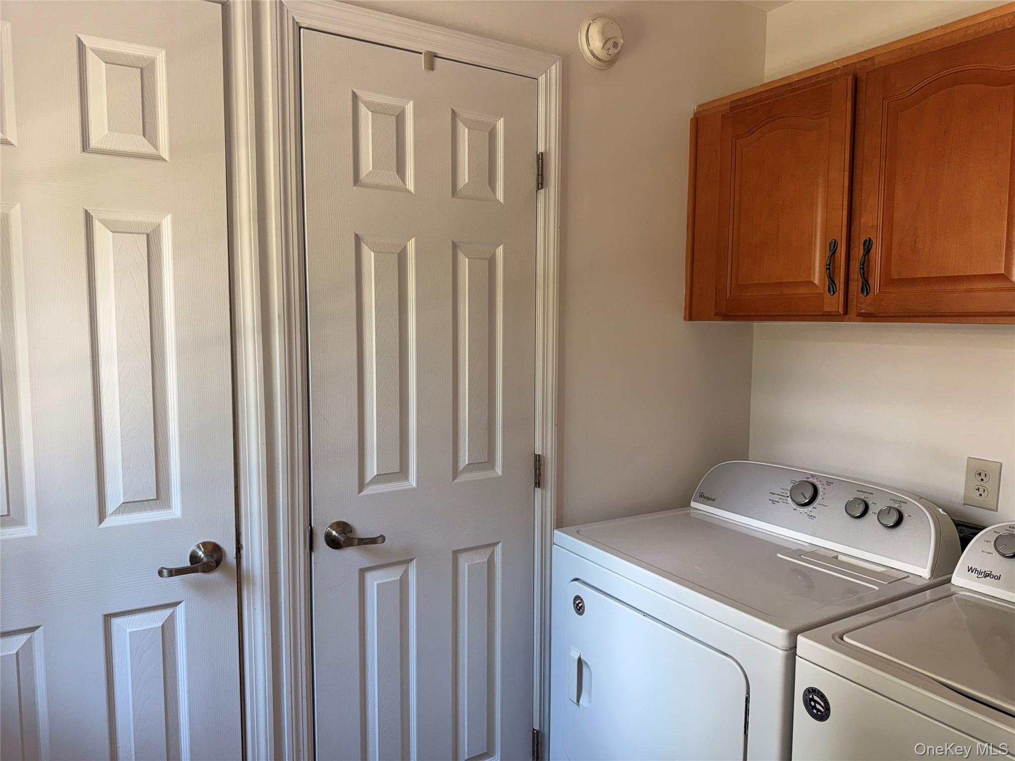 1661 Old Country Road, Unit 516 Riverhead, NY 11901 - Photo 23 of 50 a utility room with dryer and washer