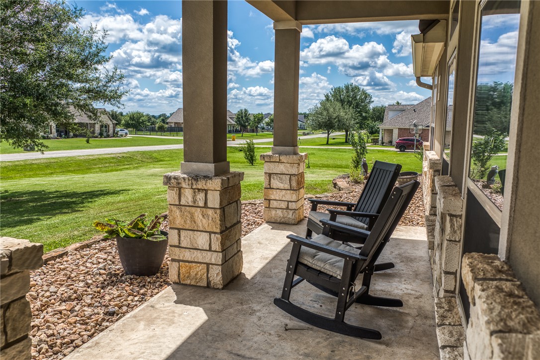 586 Ruby Drive Bellville, TX 77418 - Photo 6 of 50 a view of a garden with lawn chairs
