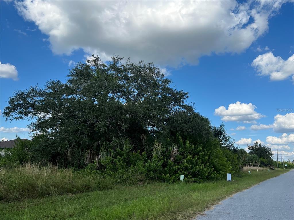 134 April Road Rotonda West, FL 33947 - Photo 2 of 2 a view of a lake and green space