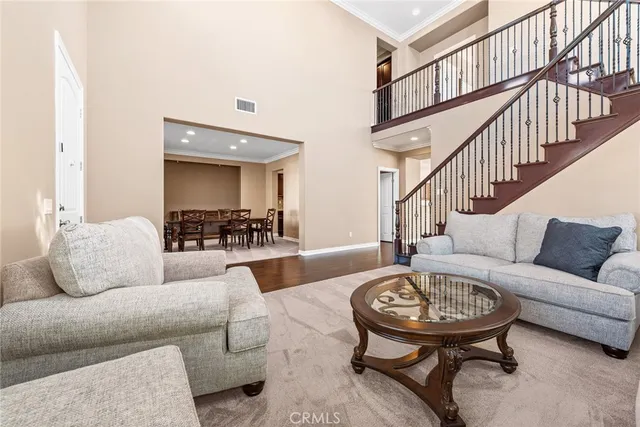 a view of a dining room with furniture and a window