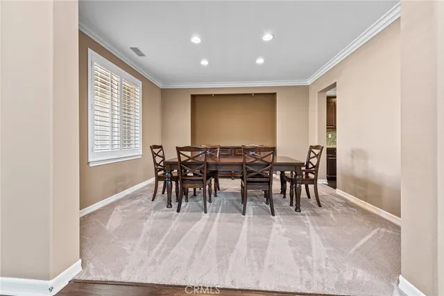 a view of a kitchen with stainless steel appliances granite countertop a refrigerator and a sink