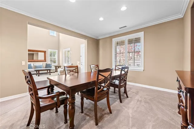 a living room with furniture and a flat screen tv with wooden floor