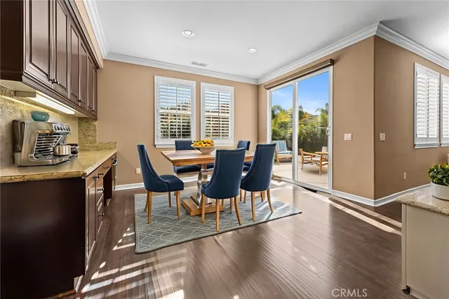 a large kitchen with stainless steel appliances kitchen island granite countertop a stove a sink and a refrigerator