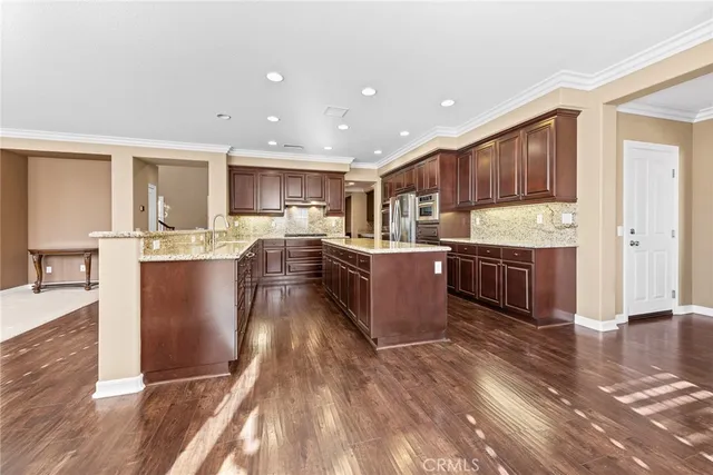 a room with a bed and a ceiling fan