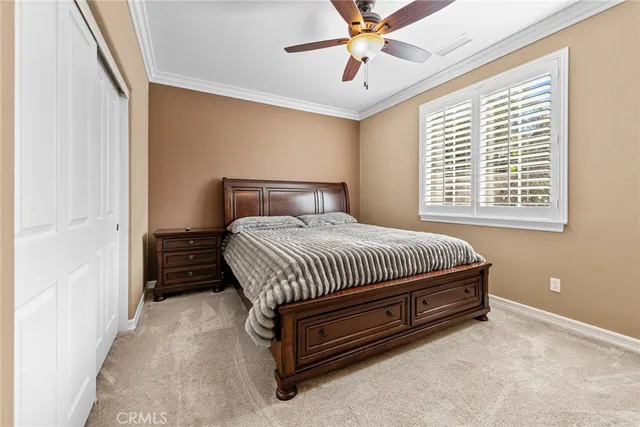 a bathroom with a granite countertop toilet sink and mirror