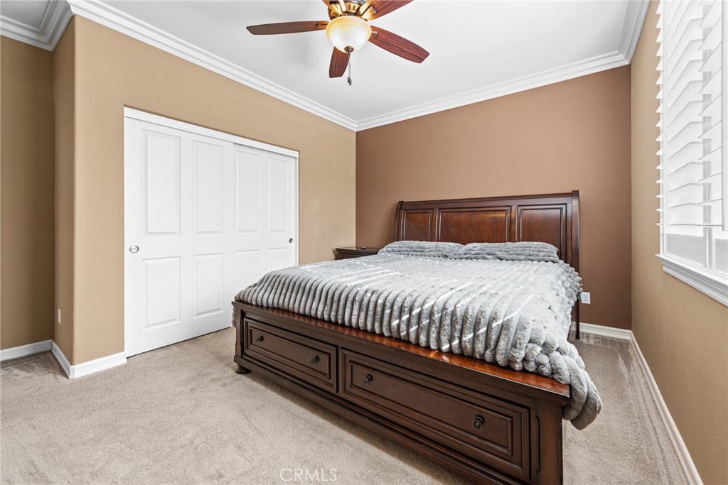 32437 Yosemite Lane Temecula, CA 92592 - Photo 26 of 63 a bed sitting in a bedroom next to a window