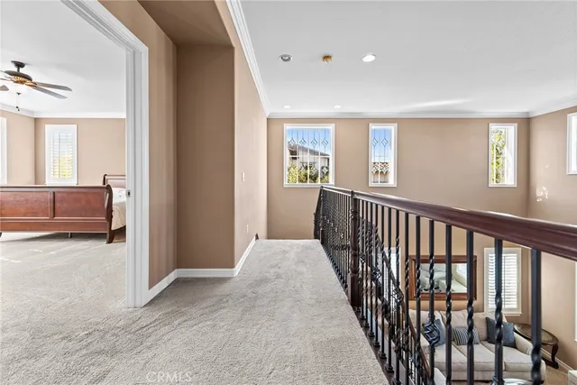 a spacious bathroom with a granite countertop tub sink shower and mirror