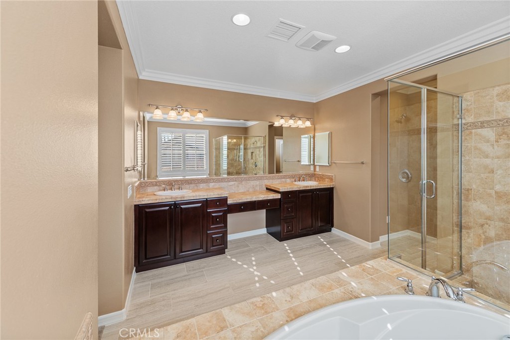 32437 Yosemite Lane Temecula, CA 92592 - Photo 41 of 63 a large bathroom with a large tub shower and sink