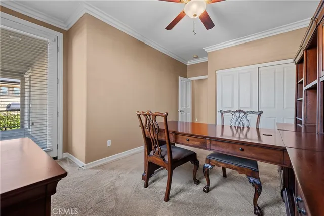 an aerial view of multiple houses with a yard