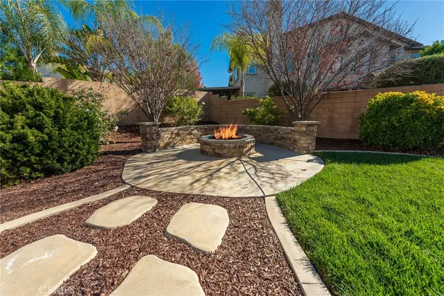 a view of outdoor sitting area with furniture and garden