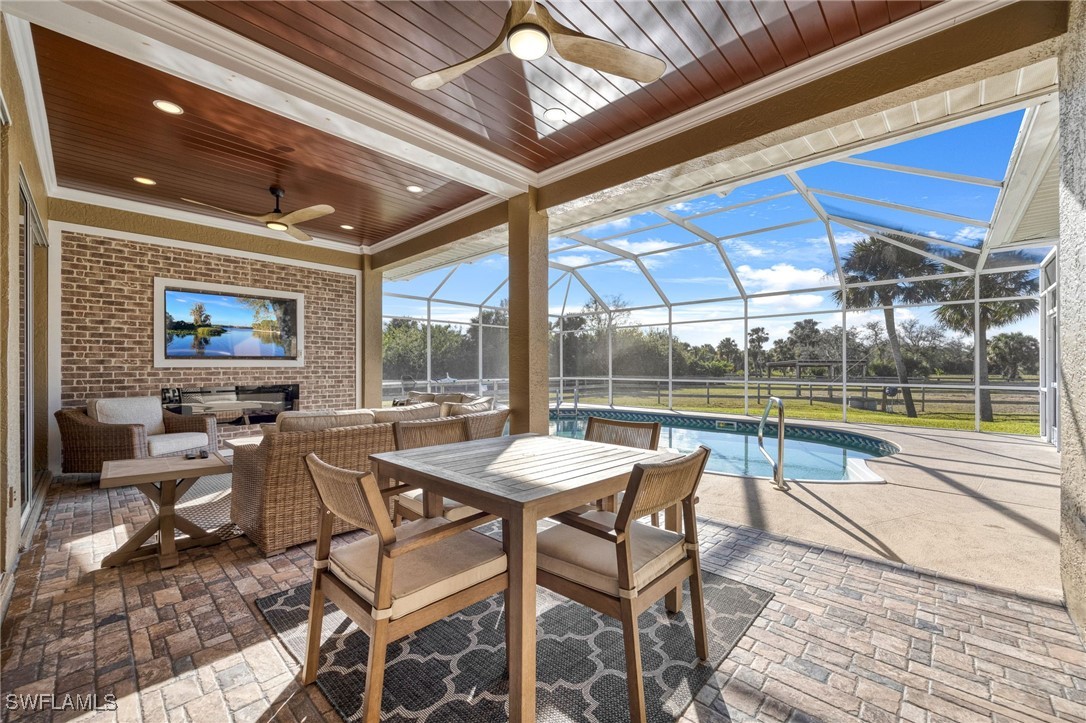 12251 Old Rodeo Drive Alva, FL 33920 - Photo 11 of 49 a view of a patio with a table and chairs
