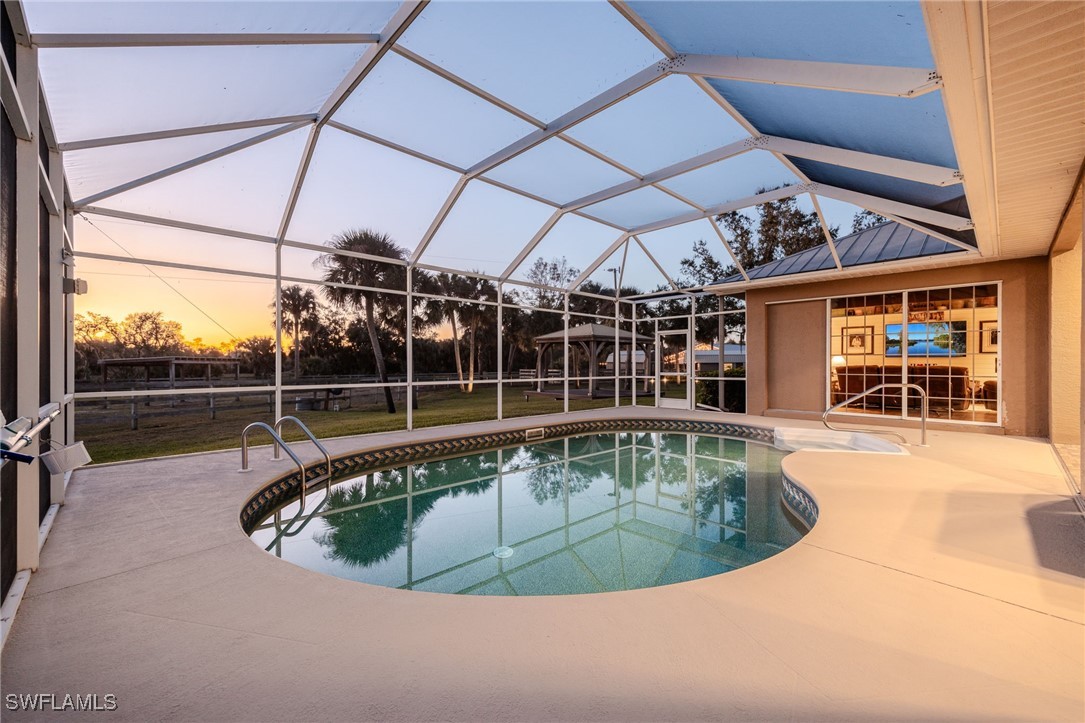 12251 Old Rodeo Drive Alva, FL 33920 - Photo 14 of 49 a view of a swimming pool with a outdoor seating