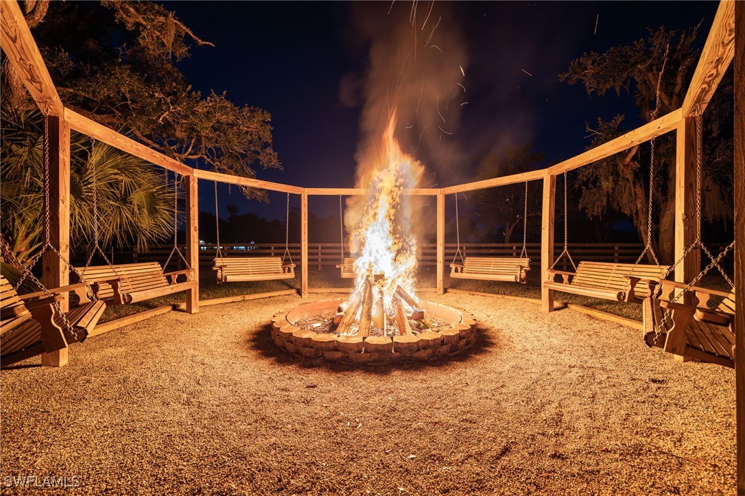 12251 Old Rodeo Drive Alva, FL 33920 - Photo 18 of 49 a view of a porch with furniture and a yard