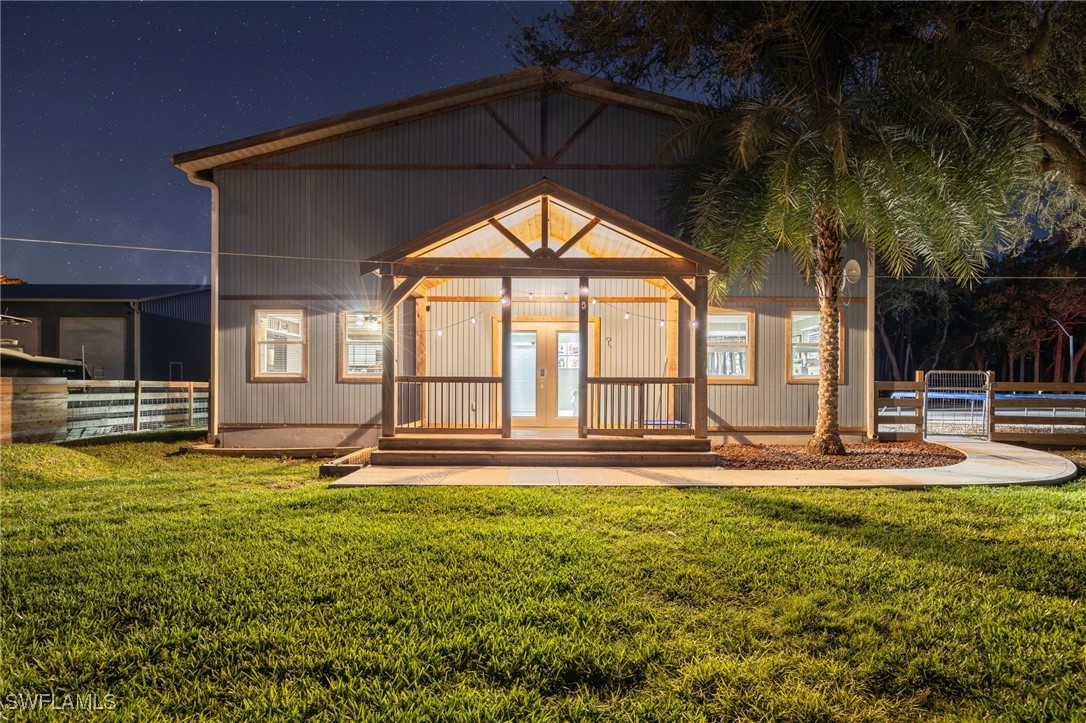 12251 Old Rodeo Drive Alva, FL 33920 - Photo 20 of 49 a house view with swimming pool in front of it