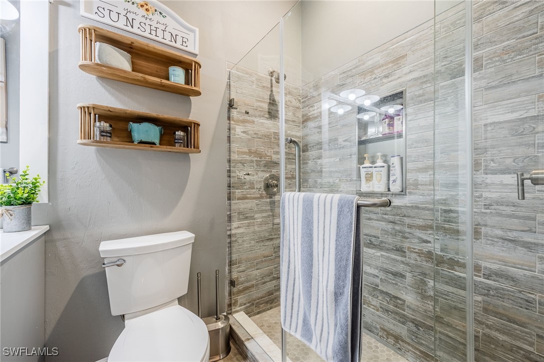 12251 Old Rodeo Drive Alva, FL 33920 - Photo 29 of 49 a bathroom with a toilet and a shower