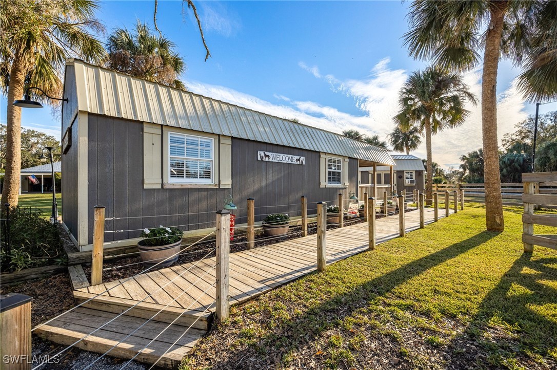 12251 Old Rodeo Drive Alva, FL 33920 - Photo 30 of 49 a view of a house with backyard and sitting area