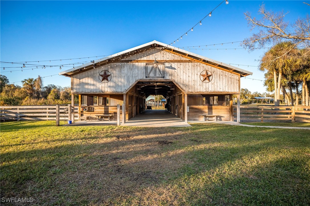 12251 Old Rodeo Drive Alva, FL 33920 - Photo 39 of 49 a view of a house with a yard