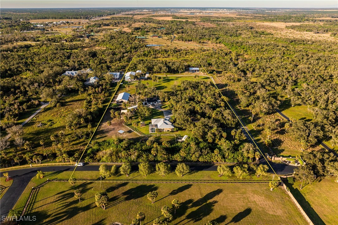 12251 Old Rodeo Drive Alva, FL 33920 - Photo 44 of 49 an aerial view of residential houses with outdoor space