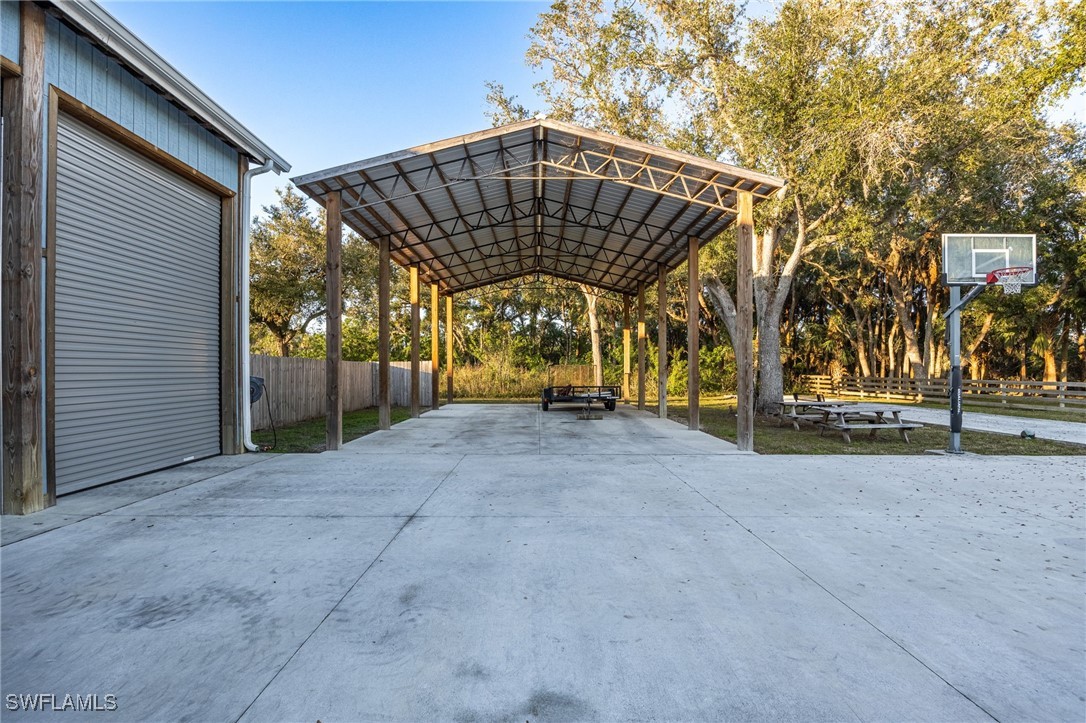 12251 Old Rodeo Drive Alva, FL 33920 - Photo 48 of 49 a view of a house with backyard and trees