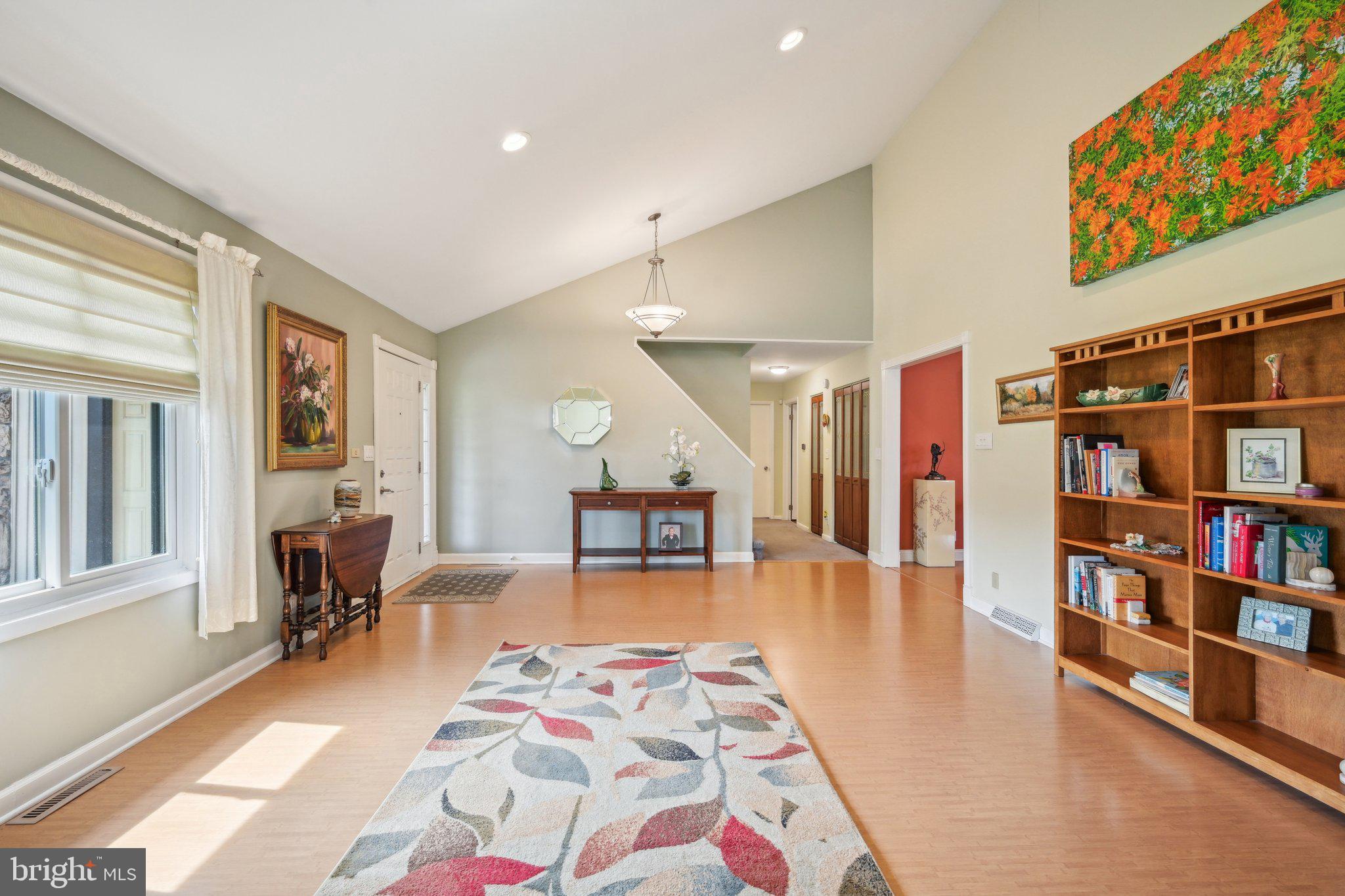205 Lehigh Road South Glassboro, NJ 08028 - Photo 51 of 51 a living room with furniture and a book shelf