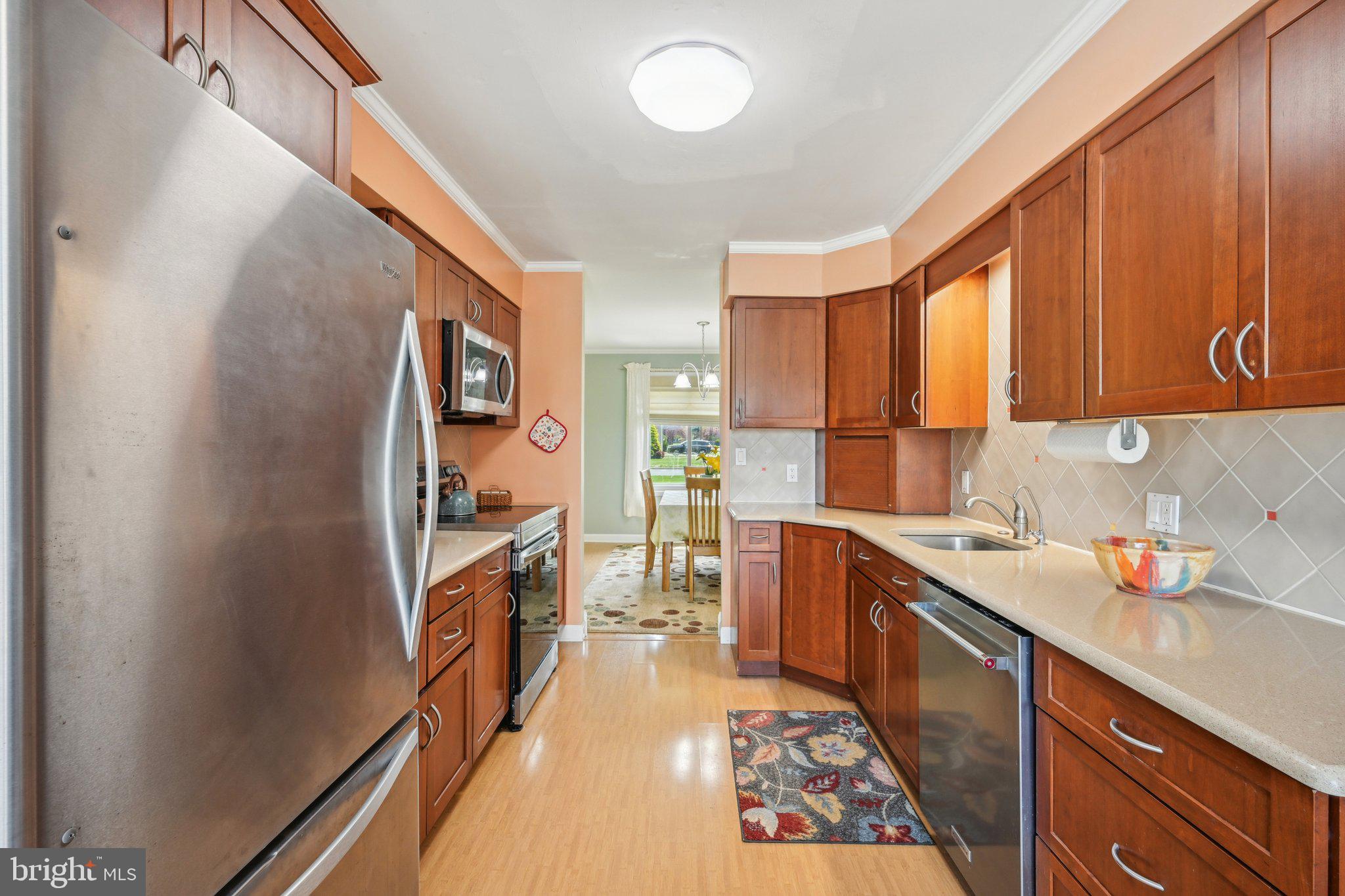 205 Lehigh Road South Glassboro, NJ 08028 - Photo 19 of 51 a kitchen with a refrigerator stove and sink